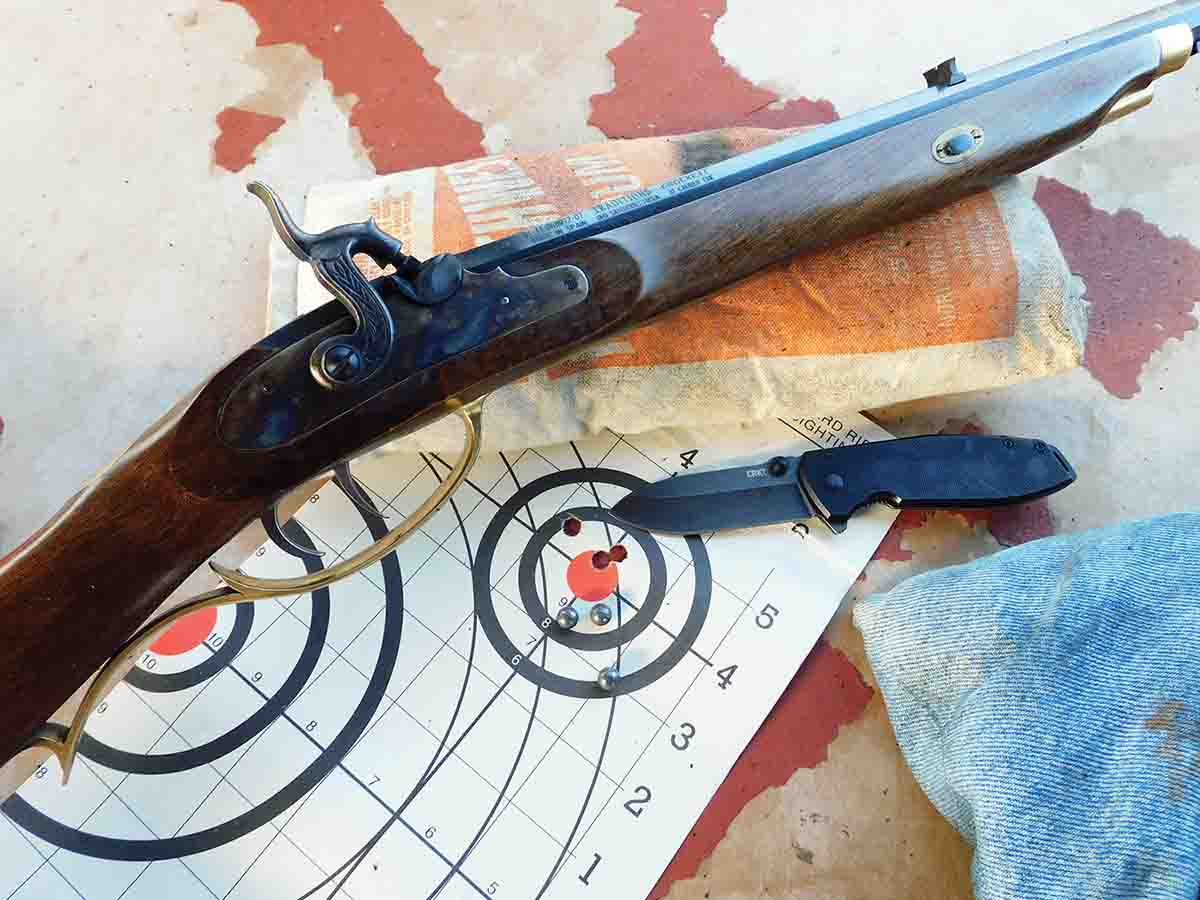 A three-shot group fired with 30 grains of black powder and a lubed and patched roundball.